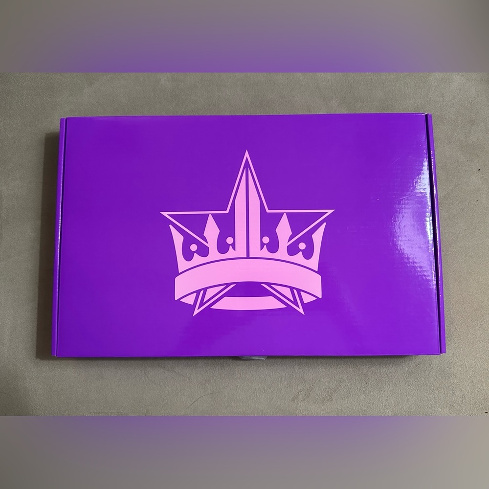 Jeffrey Star purple handheld mirror